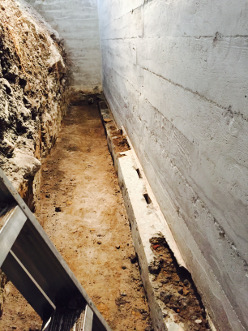 Wood stake voids in footings creating leaks